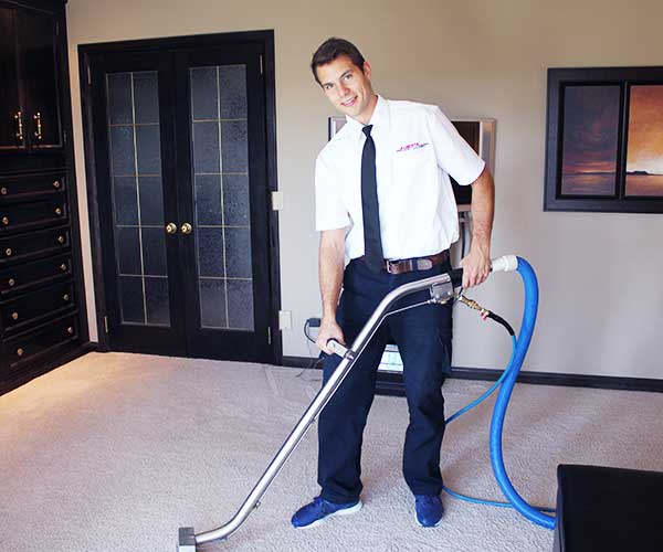 Technician-Cleaning-a-Carpet | Alberta Home Services